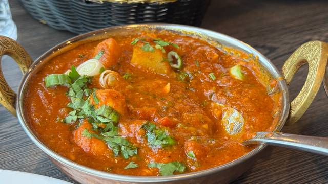 Masala House signature dishes Chicken Tikka Masala, Lamb Rogan Josh, Goat Curry, Palak Paneer